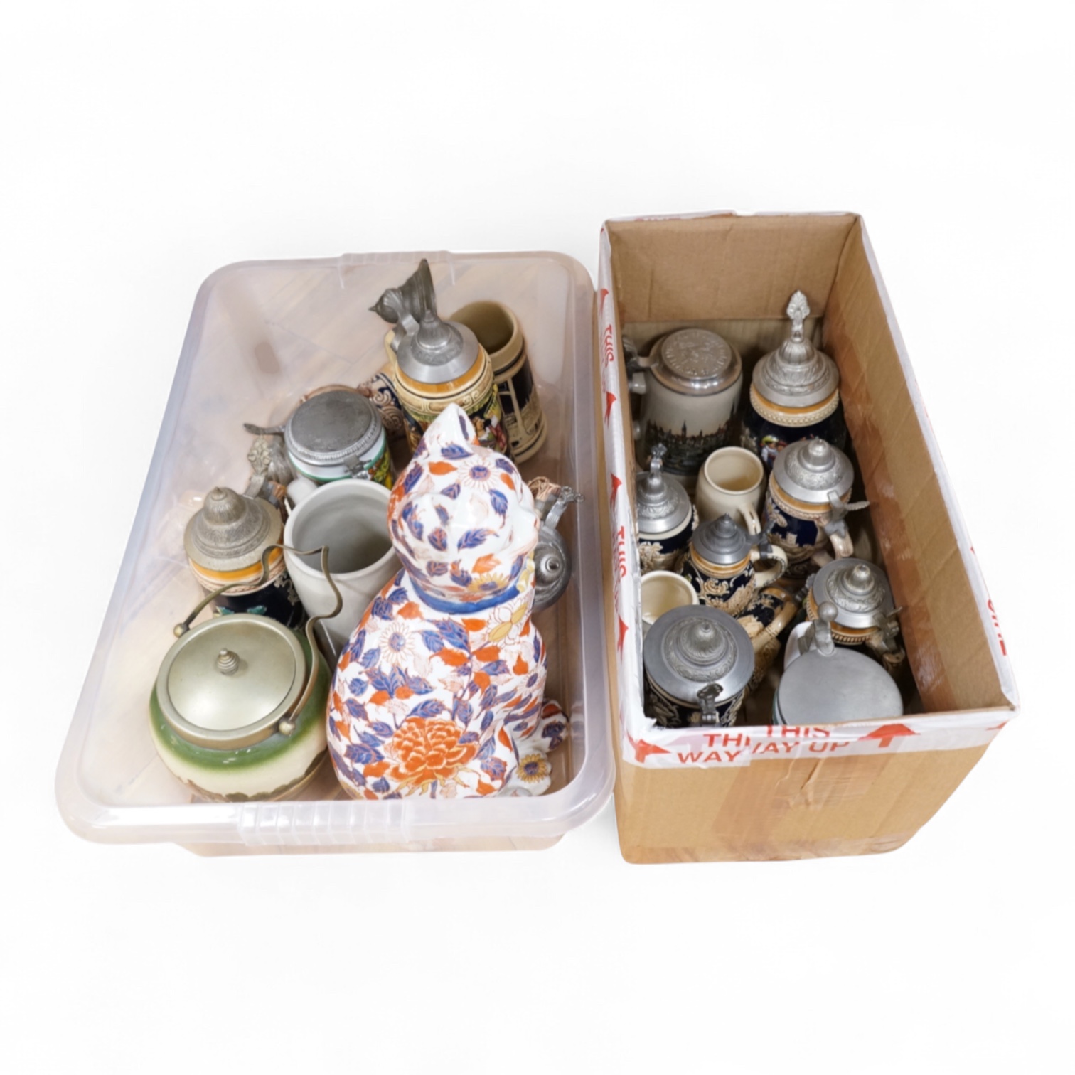 A collection of German ale steins and an Imari seated cat-37cm high